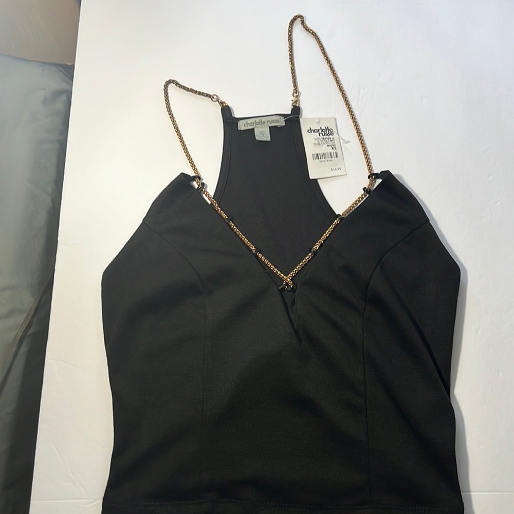 Charlotte Russe black crop top with gold chain.
